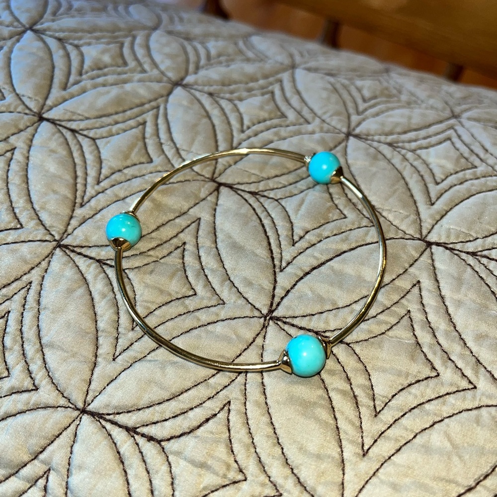 IPPOLITA 18K gold bracelet with 3 turquoise colored stones.
